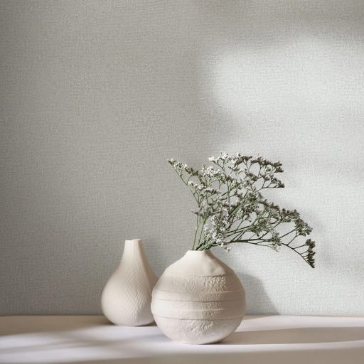 Finom szemcsés felületű egyszínű texturált minta lágy szürke krémszürke és ezüstös-szürke tónus finom mintafény tapéta